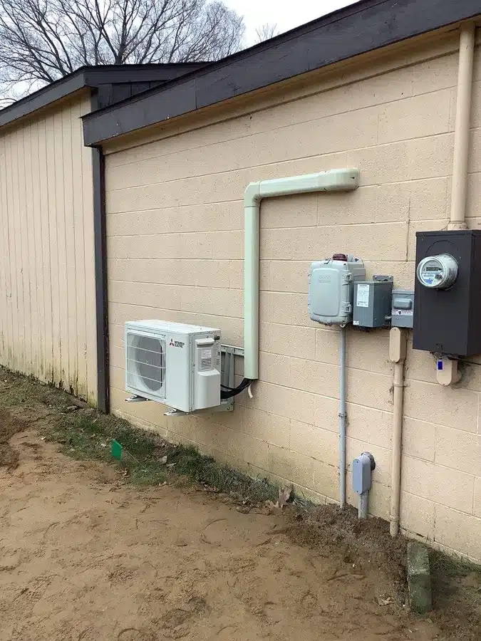 Heat pump outside of residential home in Ann Arbor, MI.